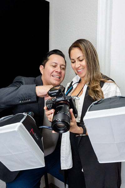 dr. torres holding a camera